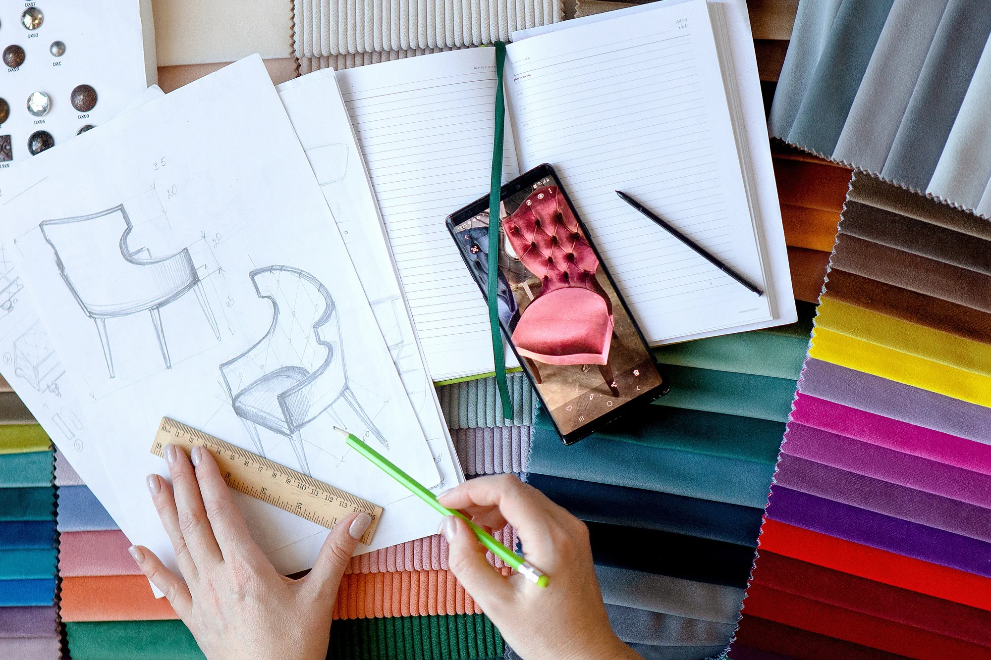 furniture designer chooses fabric and model of chairs